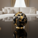 Boule Platinium Flo en émaux de Longwy sur une table en verre