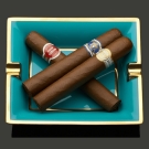 Cendrier Byzance en turquoise et or contenant trois cigares haut de gamme