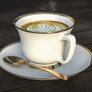 Tasse de café latte fumante avec motif de latte art, illustrant un accord moka gourmand pour une bougie parfumée
